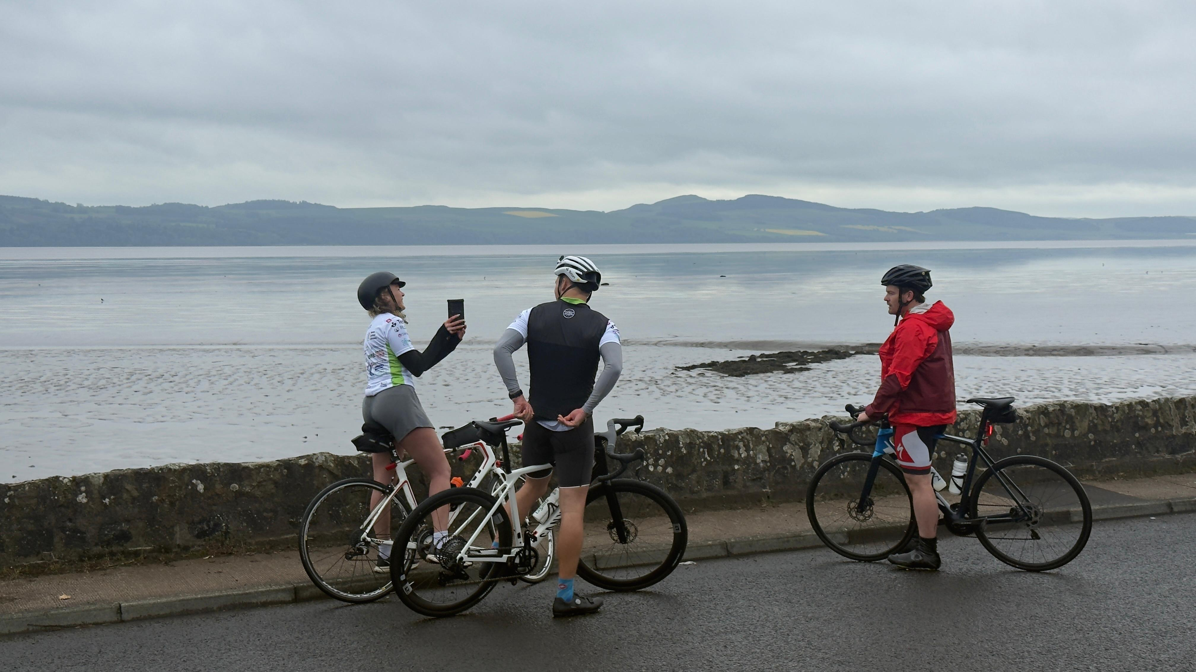 Cyclists taking a break by the water in Scotland